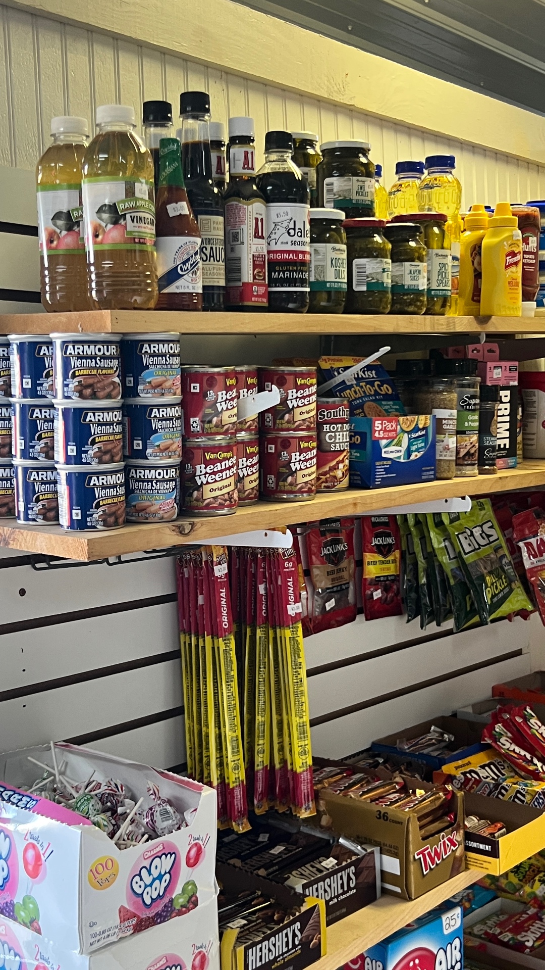 Shelves of camp groceries, snacks, jerky and candy