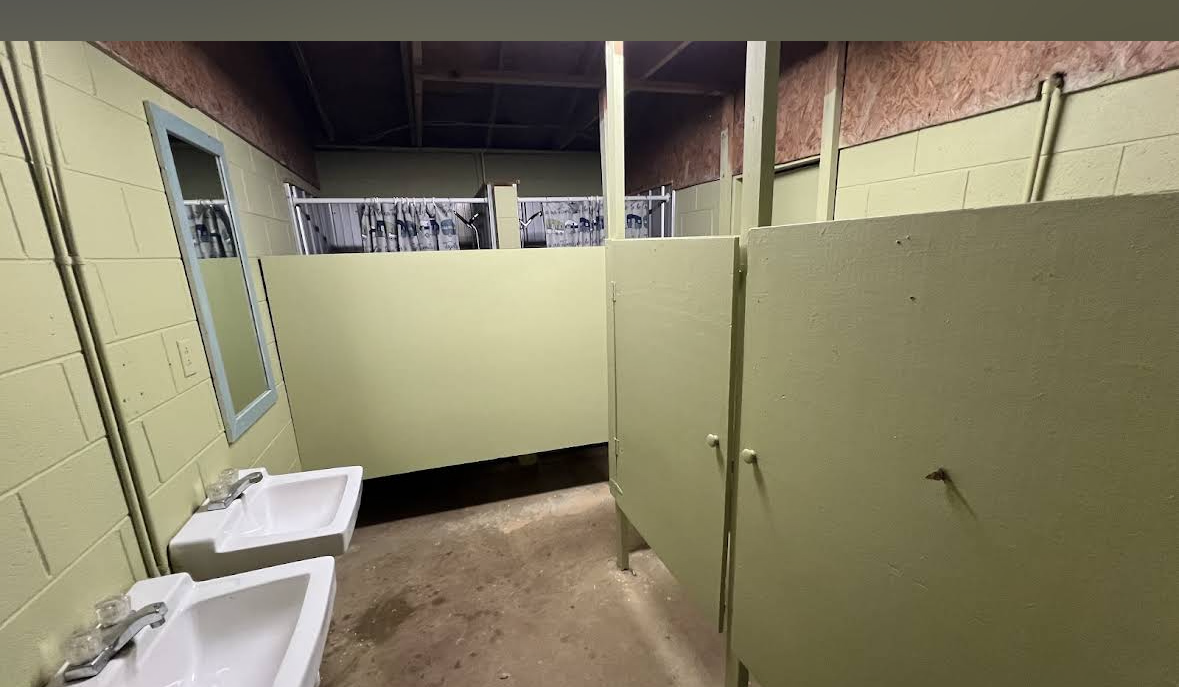 Restroom stalls, sinks and mirrors inside the North Campground shower house