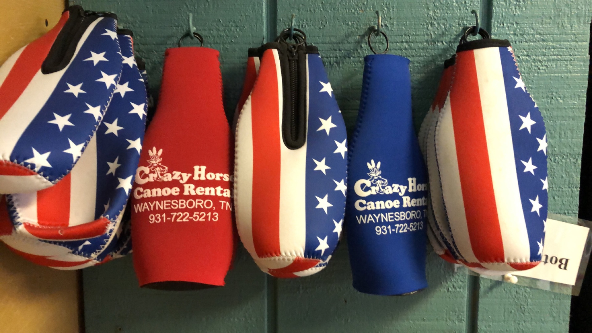 Patriotic zip-up bottle koozies with the Crazy Horse logo
