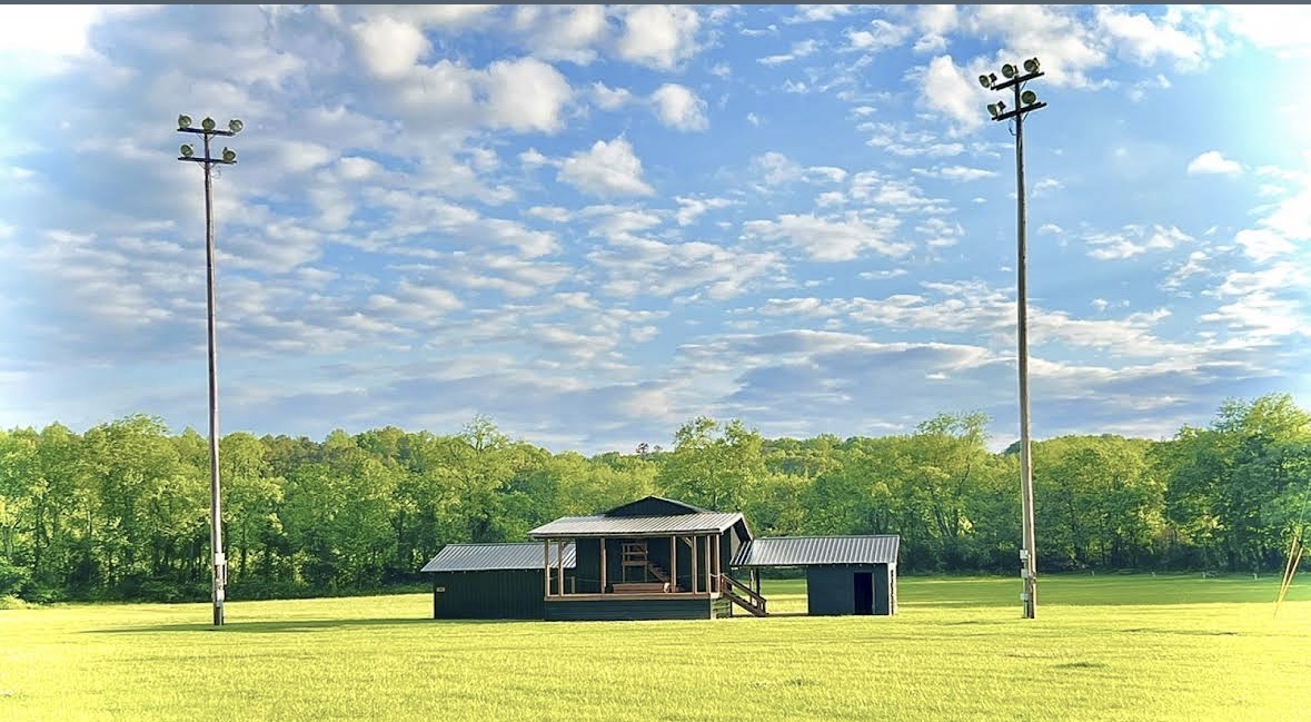 The Crazy Horse event stage and open field under a blue sky before showtime