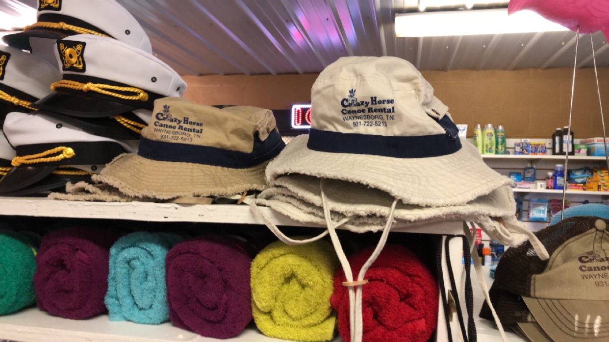 Crazy Horse Canoe Rental bucket hats and rolled beach towels