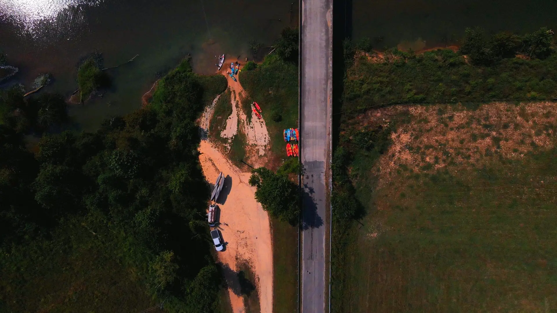 Aerial view of kayaks staged by the bridge