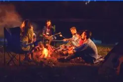 Friends gathered around a campfire at Crazy Horse