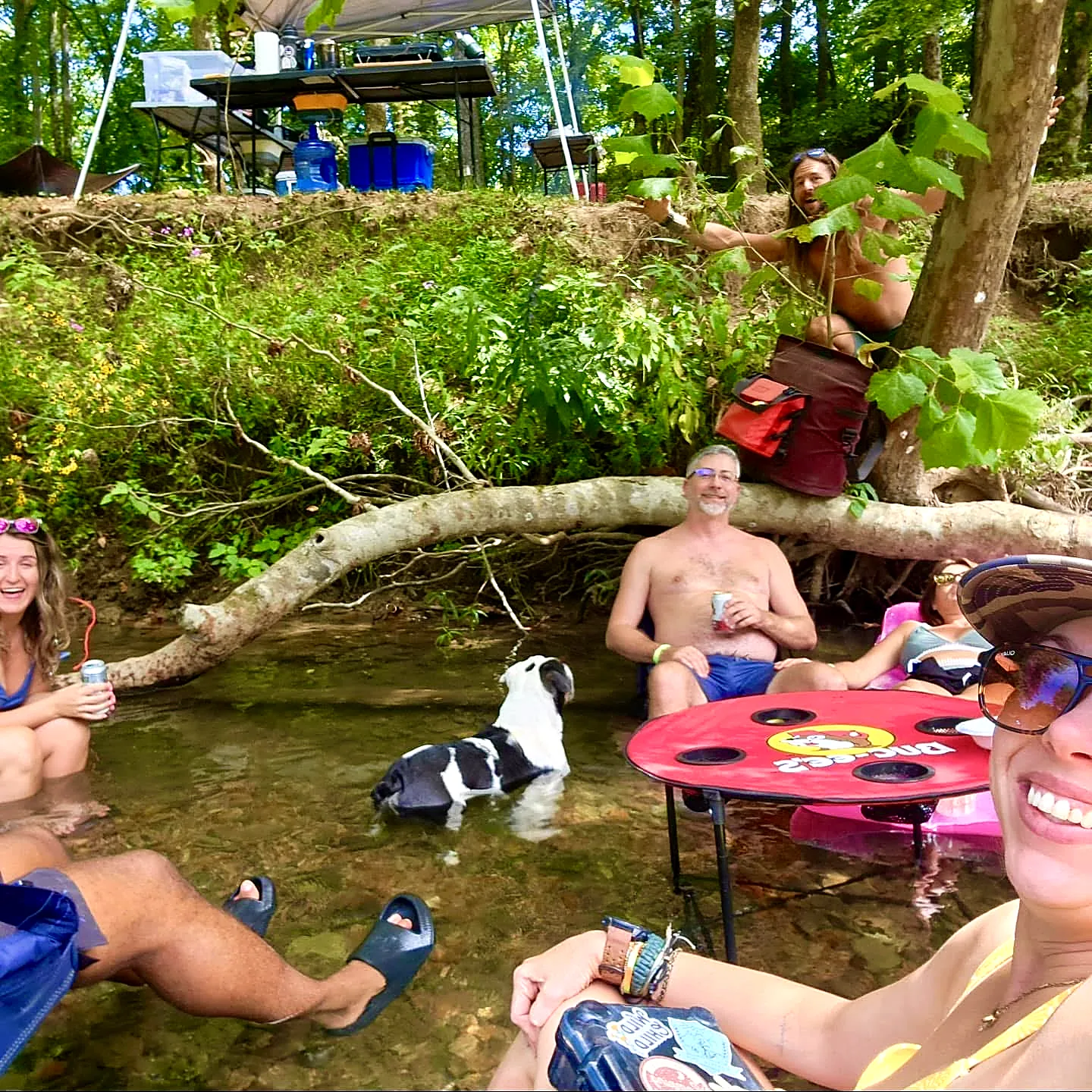 Hanging out in a shallow creek with the dog