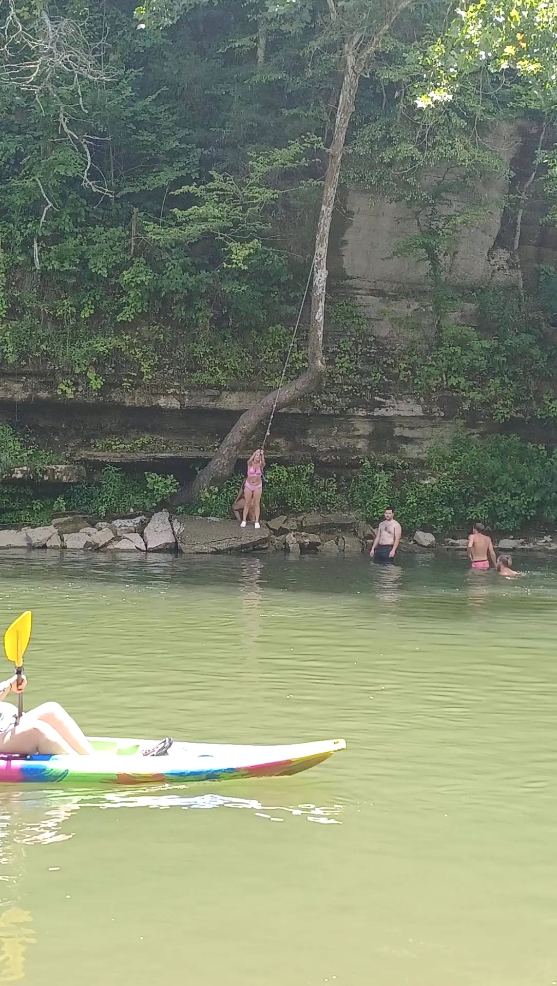 Rope swinging beneath the Buffalo River bluffs